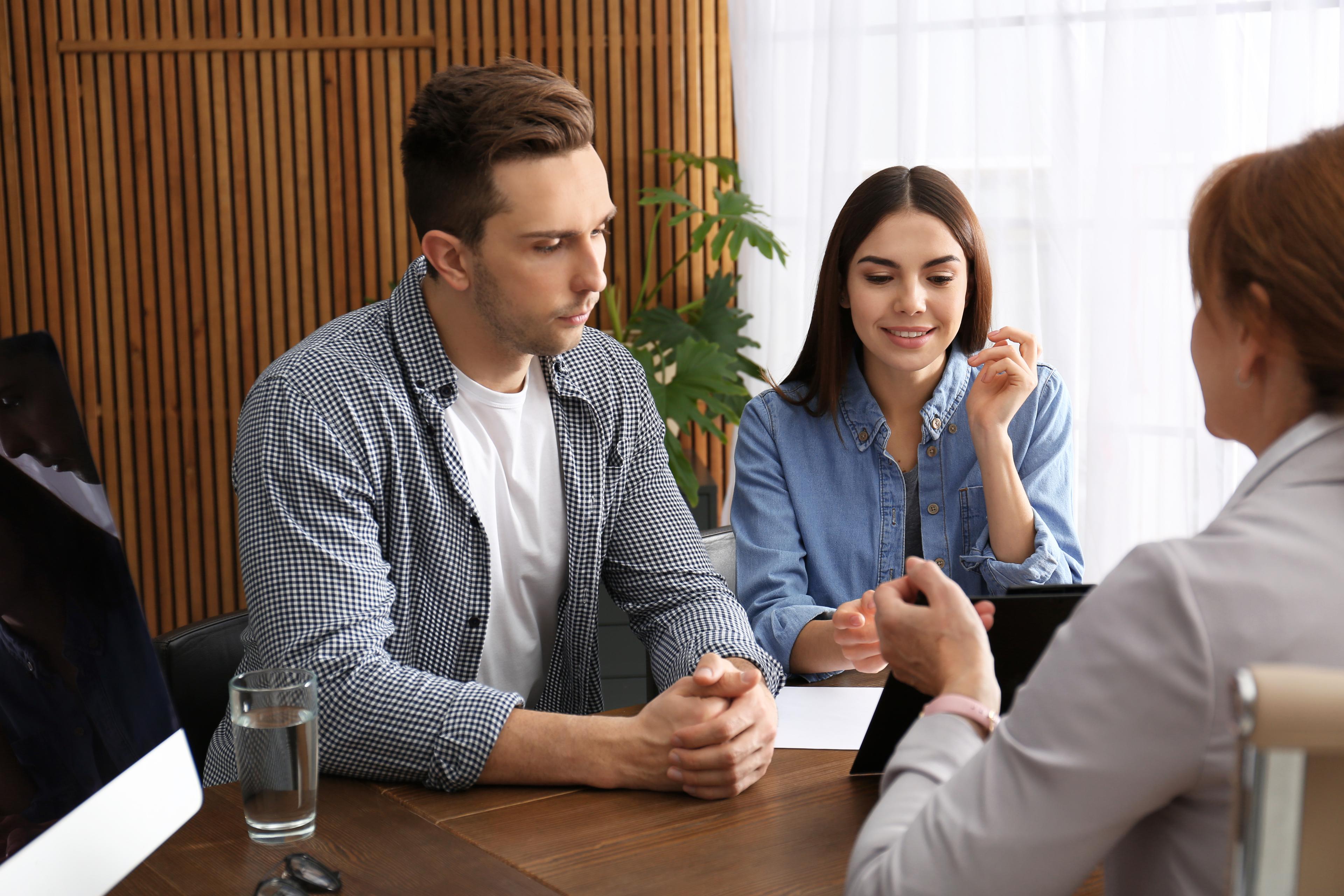 A couple reviewing their insurance claim with a licensed public adjuster
